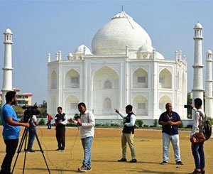 An Indian erects a copy of the Taj Mahal, a message of love to his wife