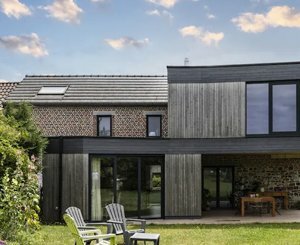 A mix of wood and natural slate for exterior cladding