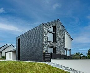 Slate on the roof and on the facade for a house that combines aesthetics and...