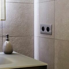 Modular, ecological and resistant design switch in brushed aluminum
