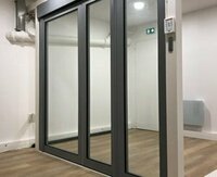 Cybèle, the fire-resistant glazed two-way steel door, now available on a motorized floor pivot