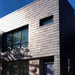 Ventilated facade in uniform and regular natural slate
